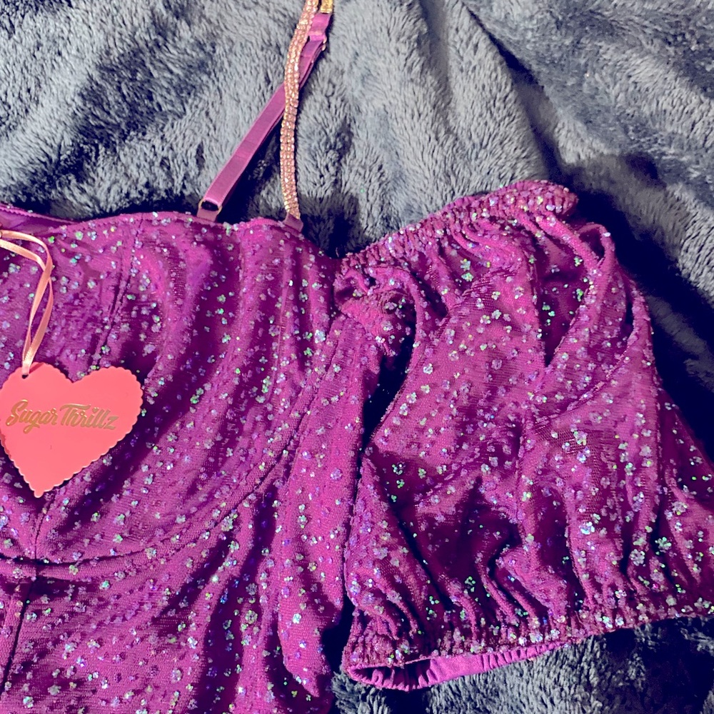 Sugar thrillz purple cropped corset and skater skirt.